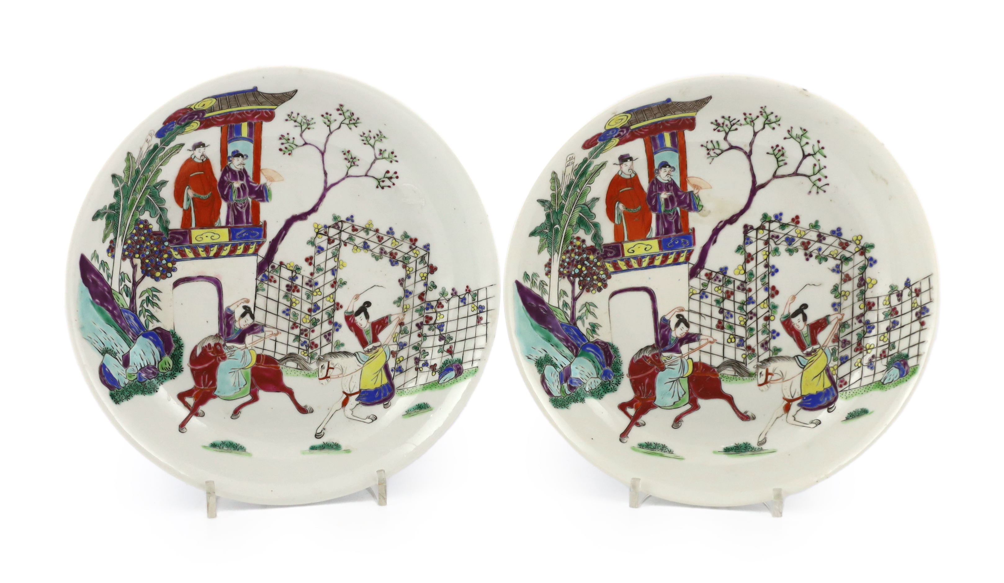 A pair of Chinese famille rose saucer dishes, Yongzheng mark but first half 19th century, one dish has a short hairline crack